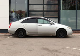 Подержанный автомобиль Nissan Primera Sedan 2004 года (14 фото)