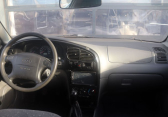 Подержанный автомобиль Kia Spectra Sedan 2006 года (15 фото)